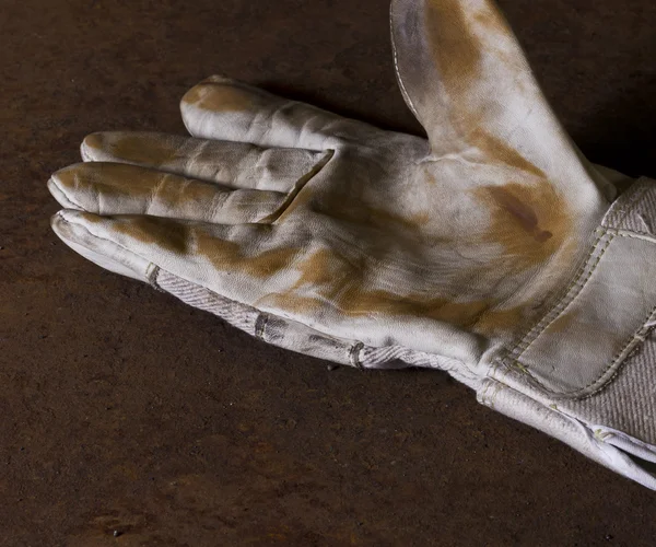 Špinavé pracovní rukavice — Stock fotografie