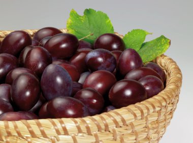 Plums in a basket clipart