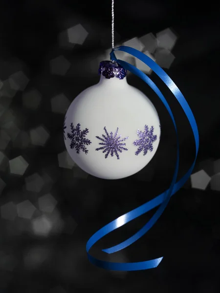 Christmas bauble with blue bow — Stock Photo, Image