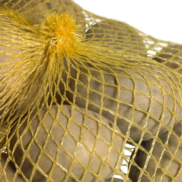 Potatoes in a net — Stock Photo, Image