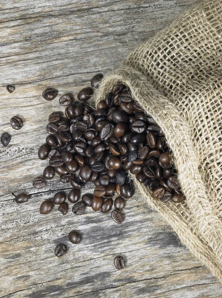 Coffee beans and jute bag — Stock Photo, Image