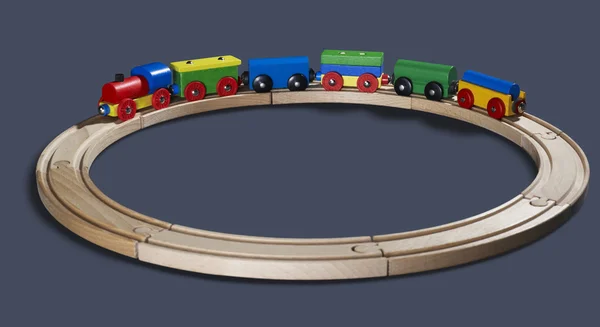 Tren de juguete de madera en las vías —  Fotos de Stock