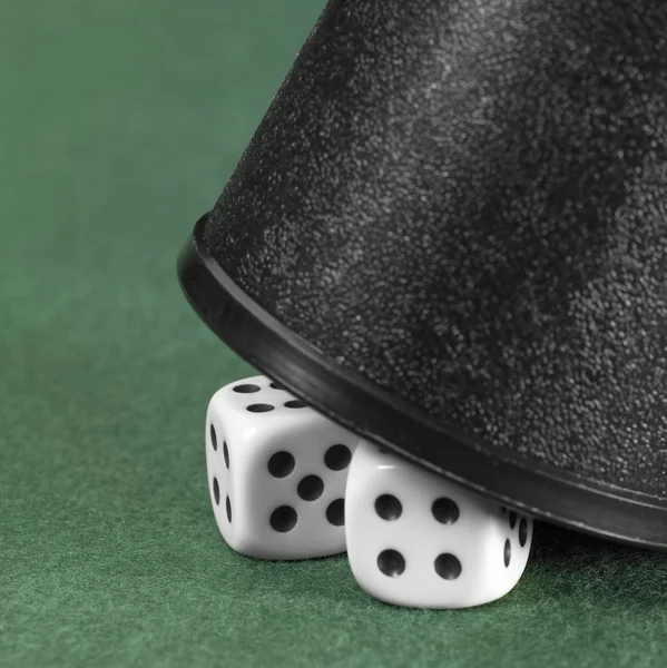 Dice and black cup — Stock Photo, Image