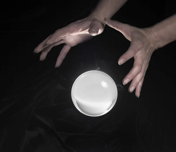 Crystal ball and hands around — Stock Photo, Image