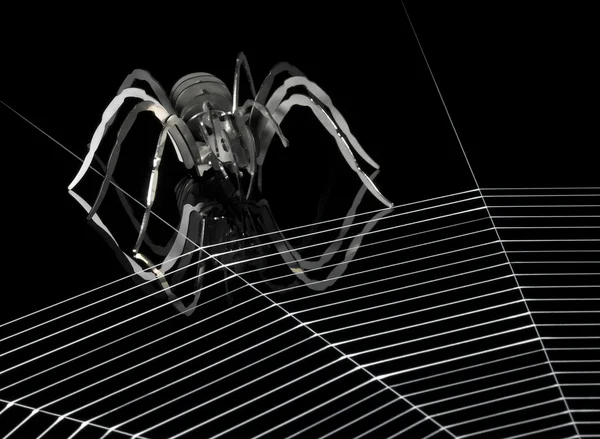 Металлический паук и паутина — стоковое фото