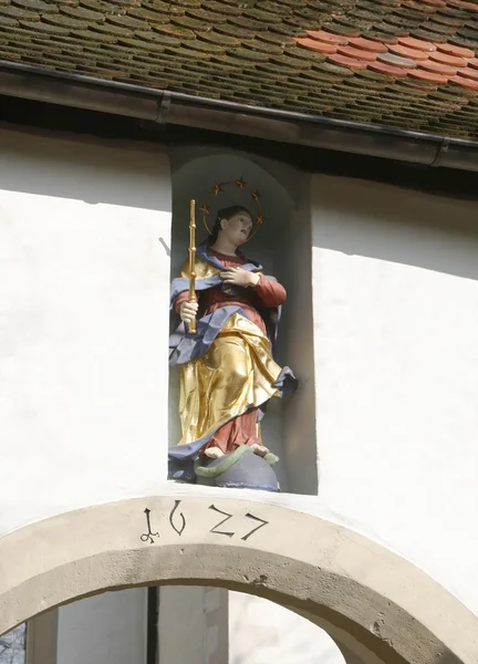 Patron saint on a house facade — Stock Photo, Image