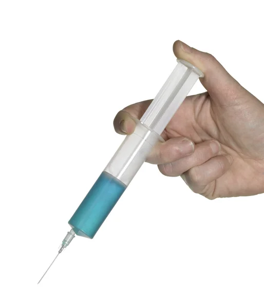 Hand and syringe — Stock Photo, Image