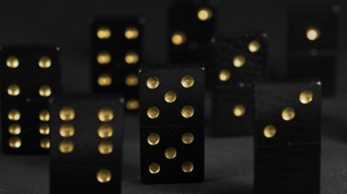 Black dominoes with golden spots clipart