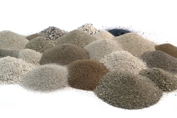 Különböző barna tónusú homok cölöpök együtt — Stock Fotó