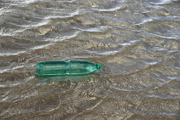 Floating green bottle — Stock Photo, Image