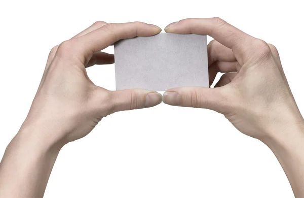 Mãos segurando um cartão limpo — Fotografia de Stock
