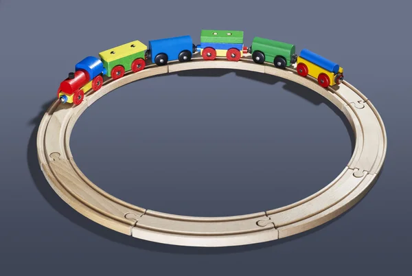 Wooden toy train on tracks — Stock Photo, Image
