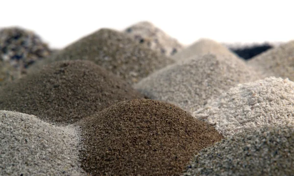 stock image Various brown toned sand piles together