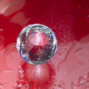 Diamond sphere in red wet ambiance clipart
