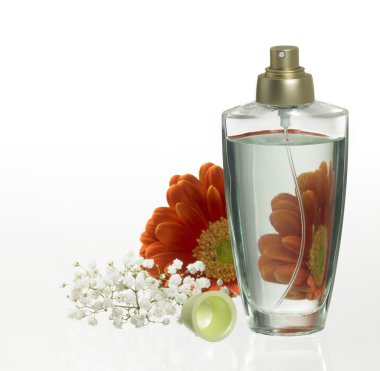 Perfume bottle and floral decoration clipart