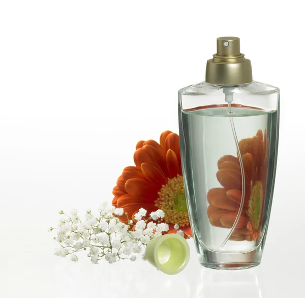 stock image Perfume bottle and floral decoration