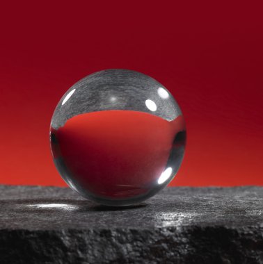 Crystal ball on stone surface clipart