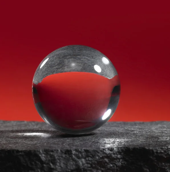 Crystal ball on stone surface — Stock Photo, Image