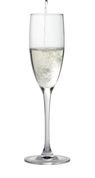 Copo de champanhe durante o enchimento — Fotografia de Stock