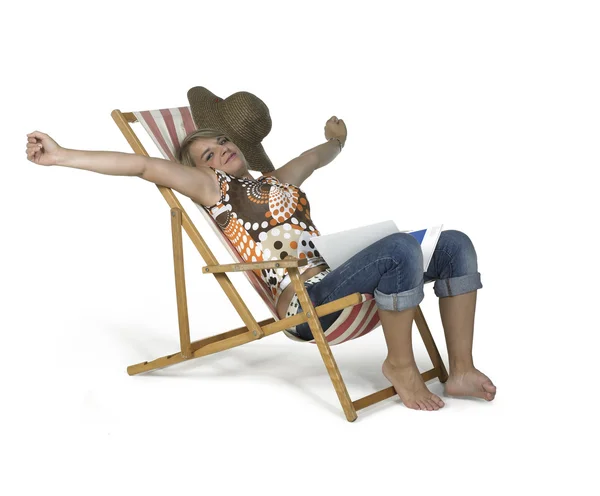 Cute girl sprawling in a canvas chair — Stock Photo, Image