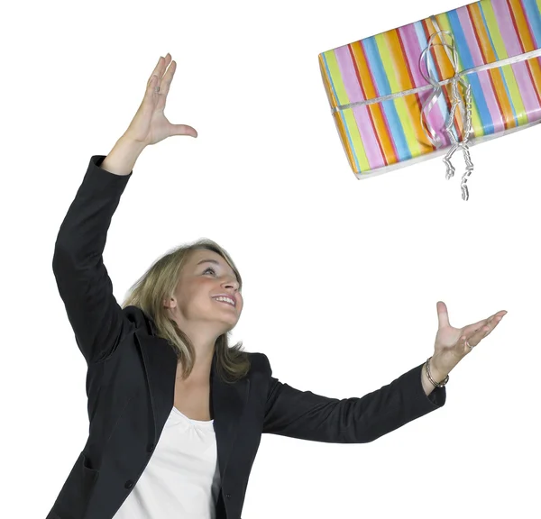 Blond girl is throwing a present — Stock Photo, Image