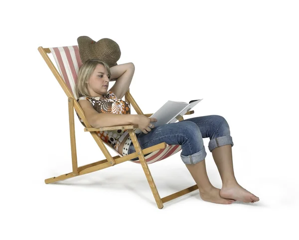 Relaxing girl in canvas chair — Stock Photo, Image