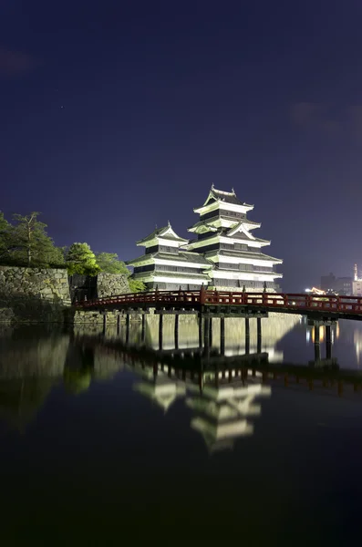 stock image Matsumoto castle at night