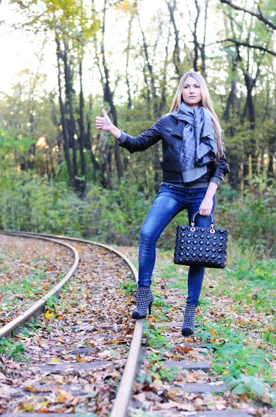 stock image Fall woman on a railroad