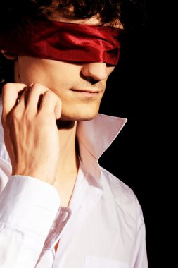 Romantic portrait of a handsome blindfold man clipart