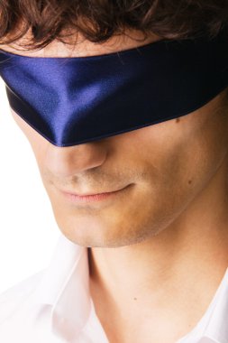 Close-up portrait of a handsome blindfold man clipart