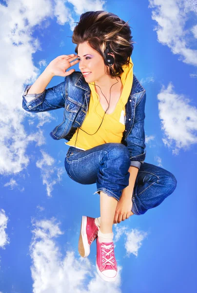 Lovely girl flying with a music — Stock Photo, Image