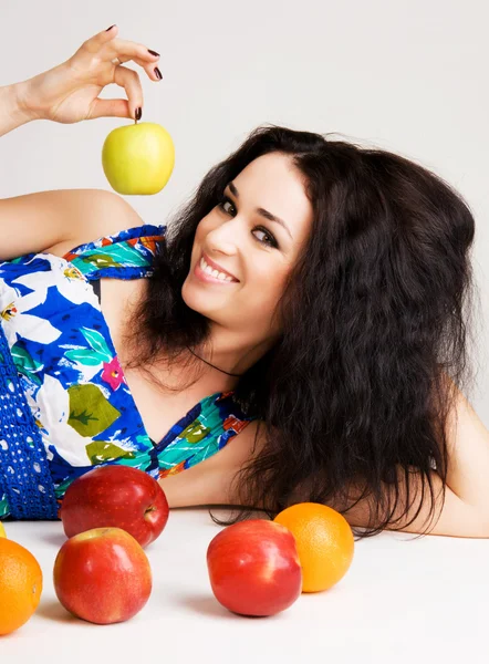Cheerful brunette with fresh fruits — Stock Photo, Image