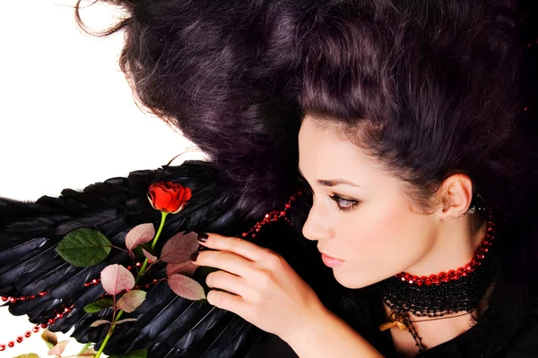 Black angel with a scarlet rose — Stock Photo, Image
