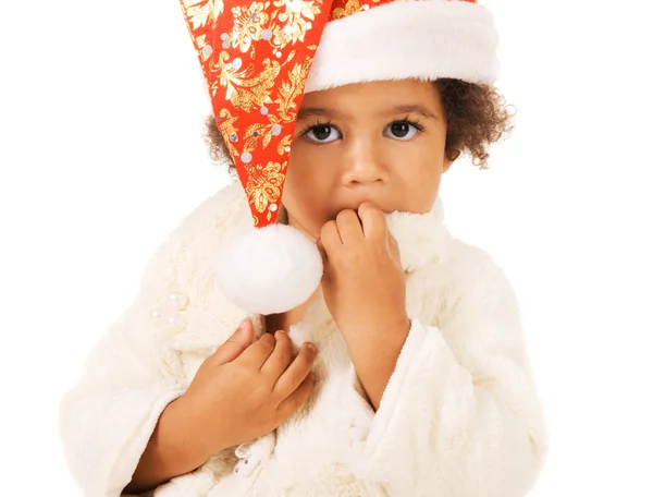Niedliches Baby mit Weihnachtsmütze und Pelz — Stockfoto