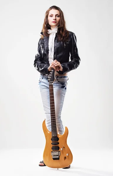 Beautiful stylish woman with electric guitar — Stock Photo, Image
