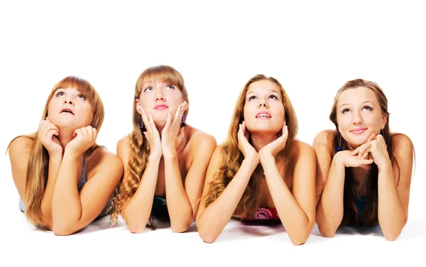 Vier mooie meisjes tot op de vloer samen — Stockfoto