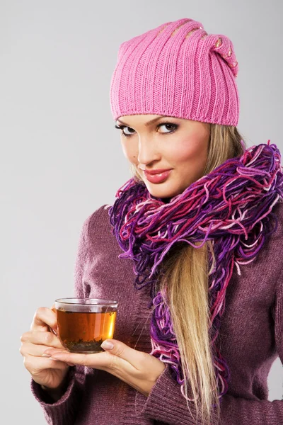 Lovely woman in warm clothing with cup of tea — Stock Photo, Image