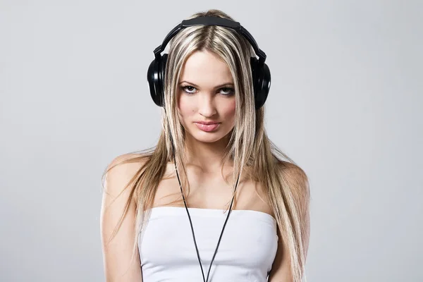 Beautiful girl in big headphones — Stock Photo, Image