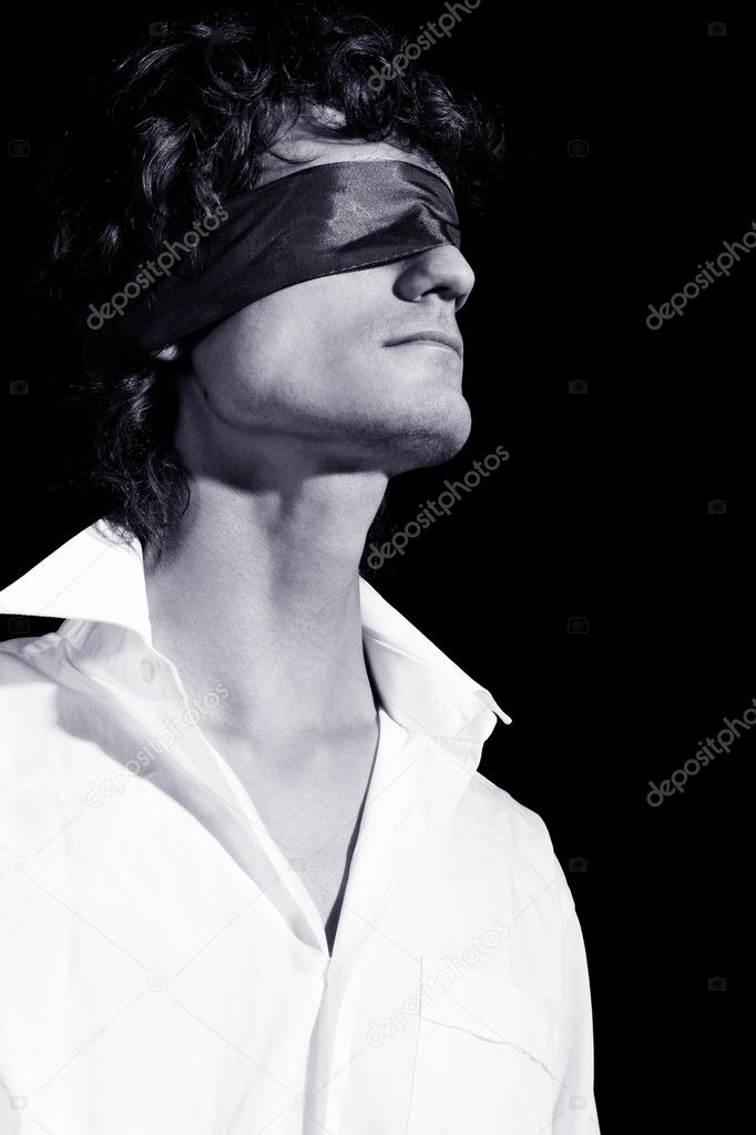 Portrait of a handsome blindfold man