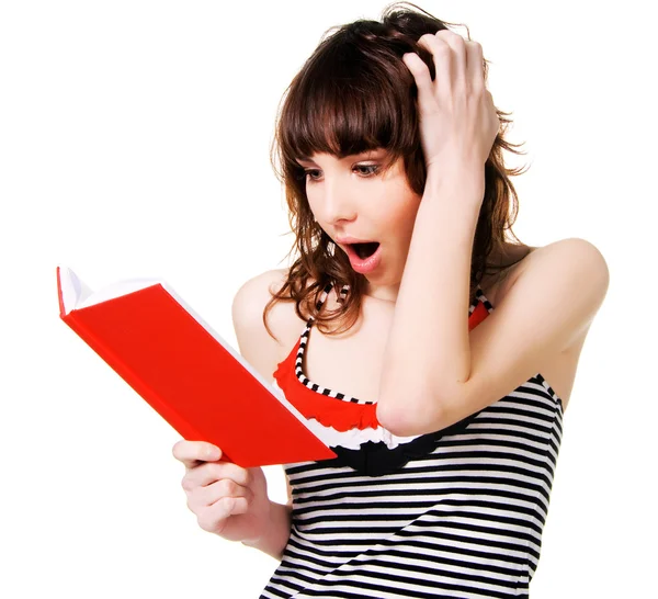 Šokován, krásná brunetka s Červená kniha — Stock fotografie
