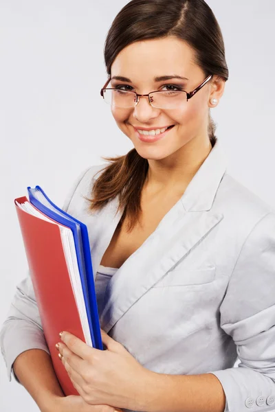 Young confident businesswoman with folders — Stock Photo, Image