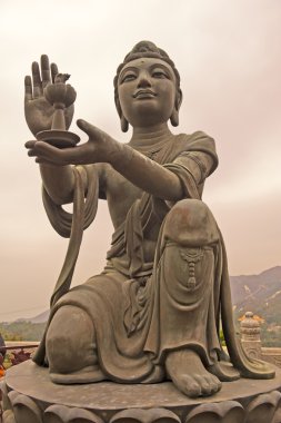 Statue in front of Buddha in Hong Kong clipart