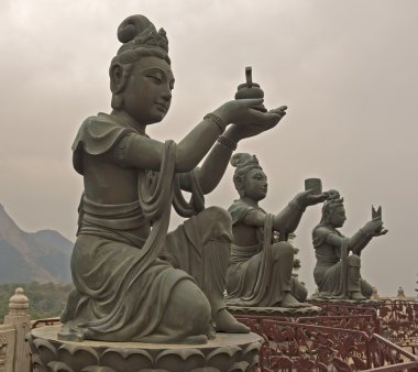 Statues In Front Of Buddha In Hong Kong clipart