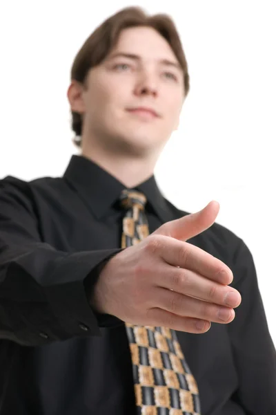 Homem de negócios estendendo a mão para aperto de mão — Fotografia de Stock