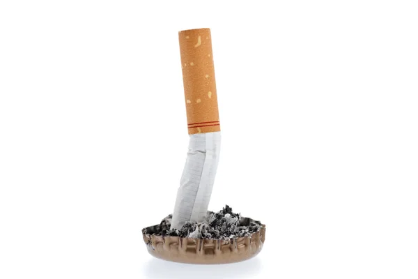 Cigarette butt and ash in a bottle cap — Stock Photo, Image