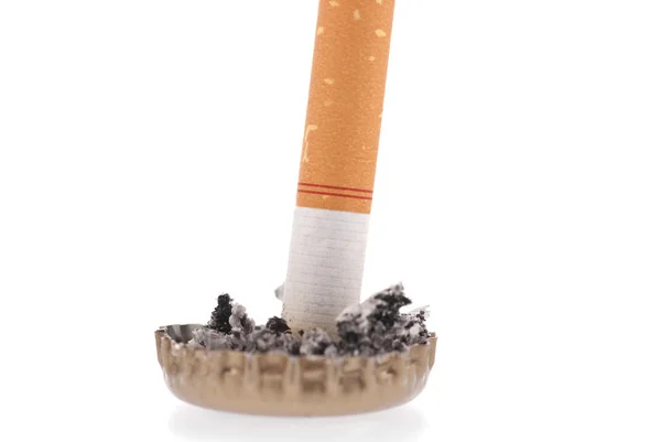 stock image Cigarette butt and ash in a bottle cap