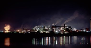 Fumes from steel mill in the harbour clipart