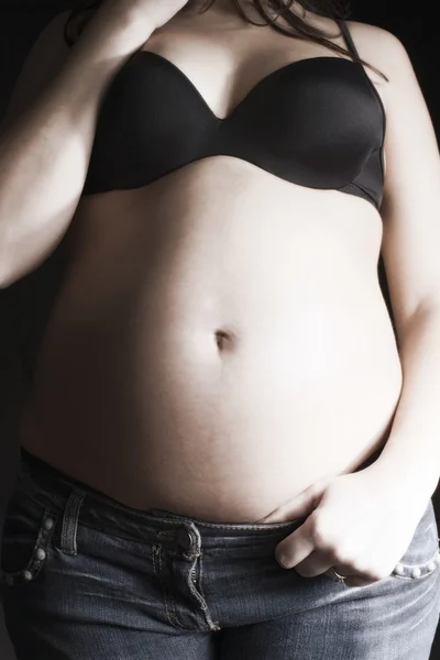 stock image Happy pregnant on a black background