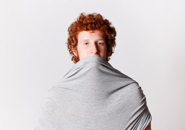 Hiding ginger attractive young man clipart