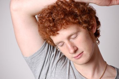 Ginger attractive lazy young man clipart